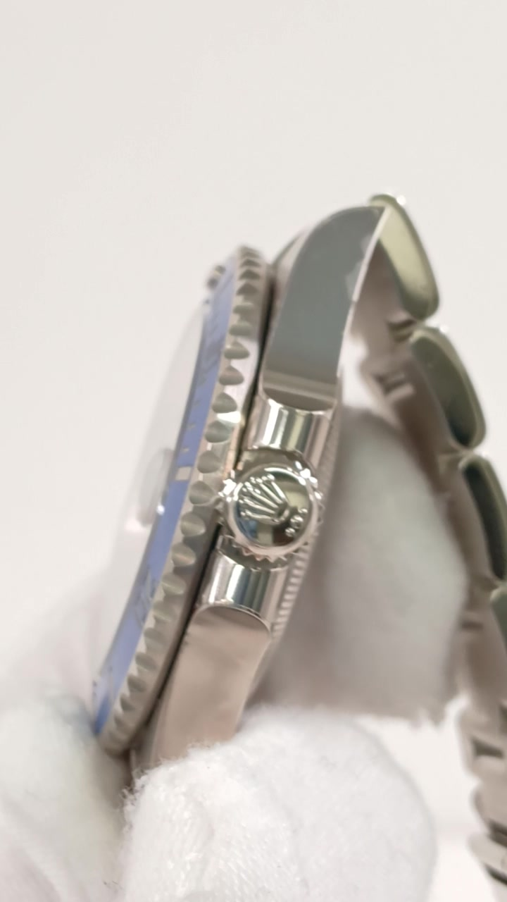 Rolex Submariner Ref 126619LB stock 33829 Crown side from vendor video