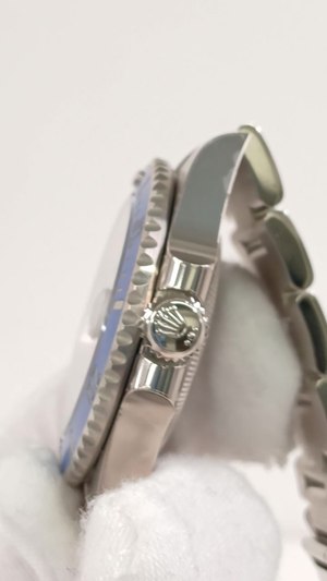 Rolex Submariner Ref 126619LB stock 33829 Crown side from vendor video