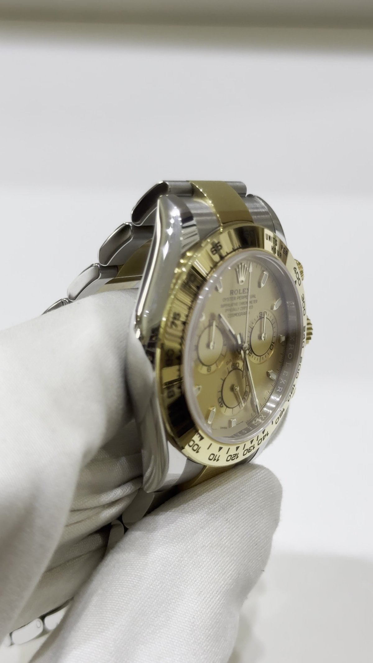 Rolex Daytona Steel and Yellow Gold — Side angle; stock 34355
