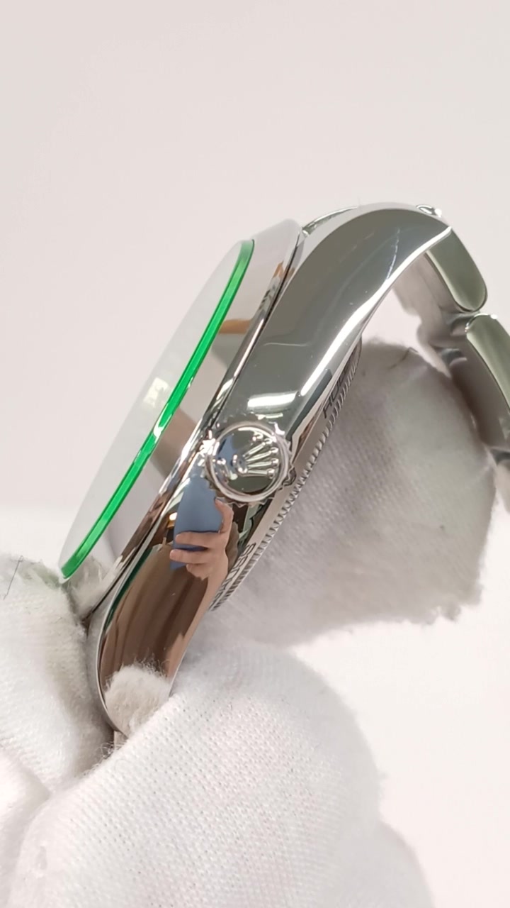 Rolex Milgauss Green Crystal — Crown side; stock 40417
