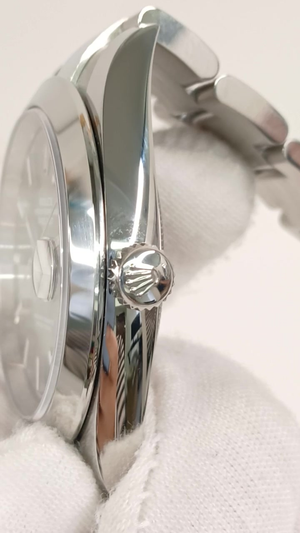 Rolex 126300 stock 57009 Crown side from vendor video