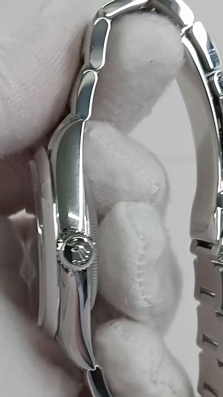 Rolex Oyster Perpetual Ref 134300 stock 75406 Crown side from vendor video
