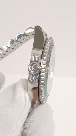 Rolex GMT-Master II Ref 126720VTNR stock 82013 Crown side from vendor video