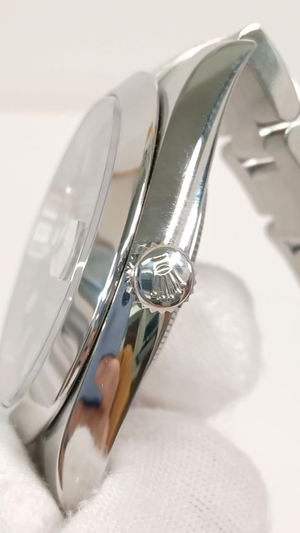 Rolex 126300 stock 82610 Crown side from vendor video