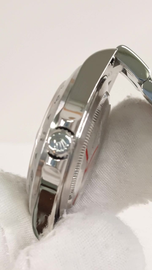 Rolex 16570 stock 91470 Crown side from vendor video