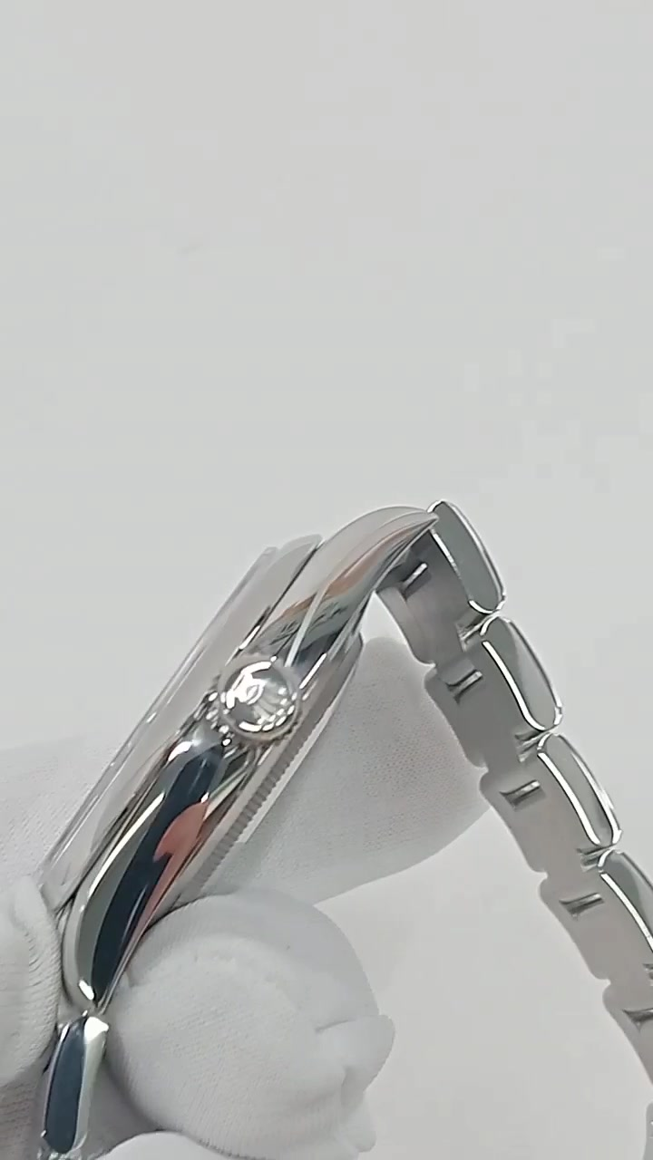 Rolex Oyster Perpetual Ref 134300 stock 93588 Crown side from vendor video