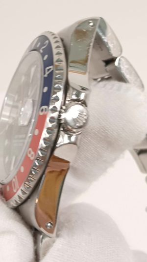 Rolex 16700 stock 97758 Crown side from vendor video